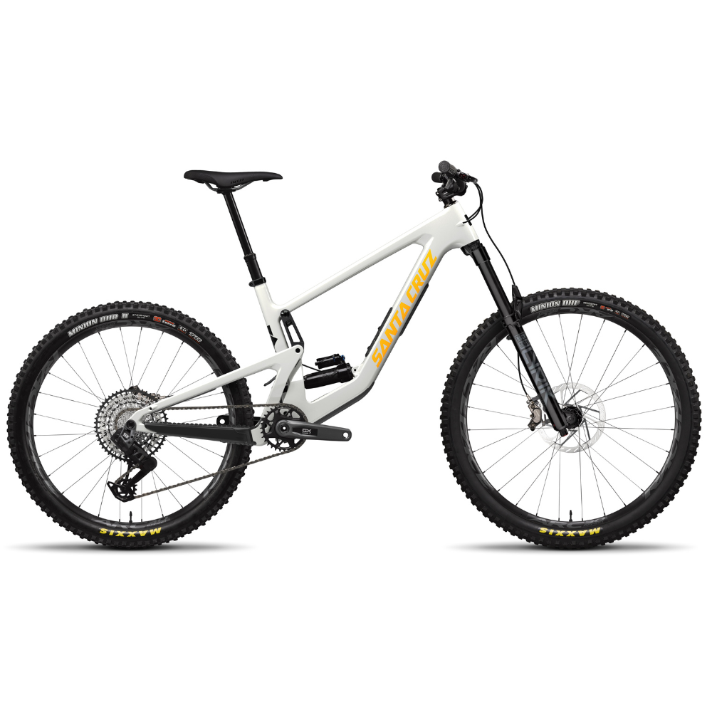 Bicicleta Santa Cruz Bronson V4 blanca con detalles amarillos en vista lateral completa.