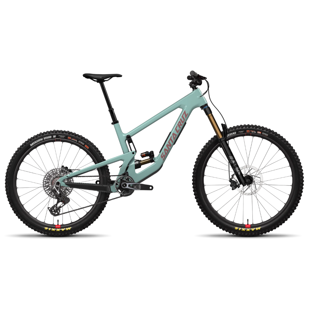 Bicicleta Santa Cruz Nomad V6 verde menta en vista lateral completa sobre fondo blanco.