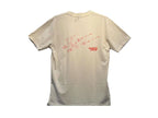 Camiseta Santa Cruz Assembly Stash Tee Warm White vista posterior con gráfico técnico rojo.