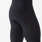 Pantalón Castelli Competizione Bibtight negro, detalle frontal de los paneles y costuras de la rodilla.